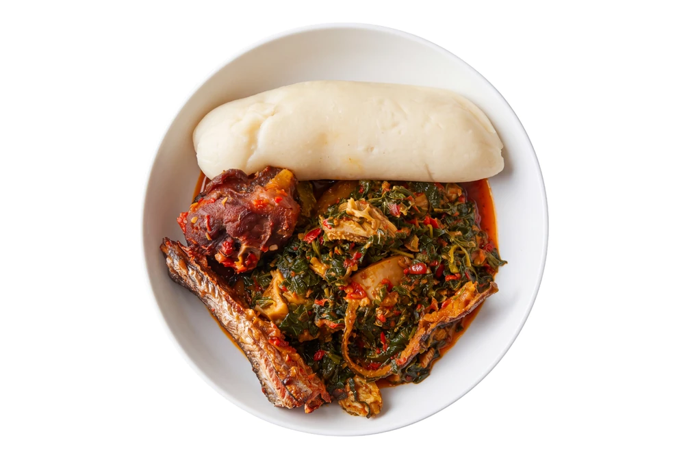 Nigerian efo riro vegetable stew with pounded yam at D'lara Kitchen in Winnipeg